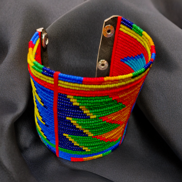 Colorful beaded bracelet on a dark fabric background