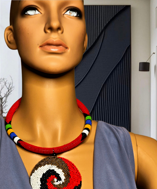 Mannequin wearing a colorful beaded necklace with a geometric pendant.